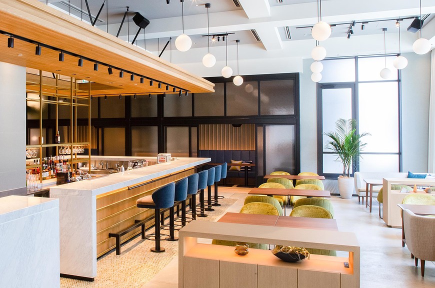 A room with tables and chairs.